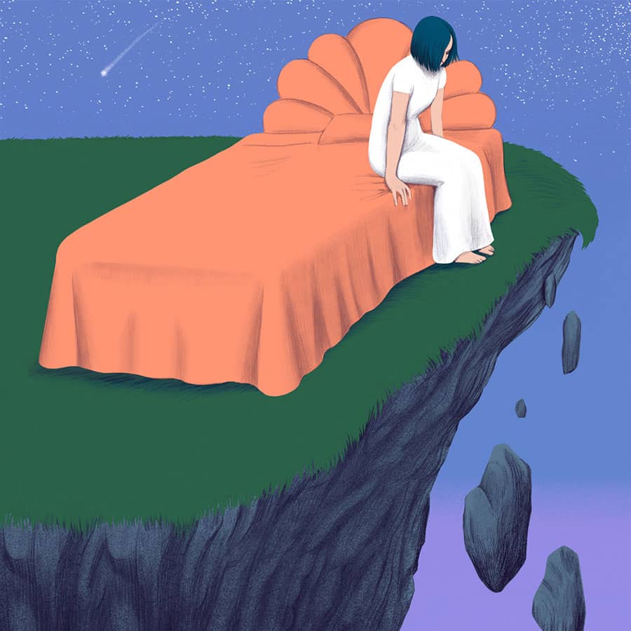 in bed on a crumbling cliff